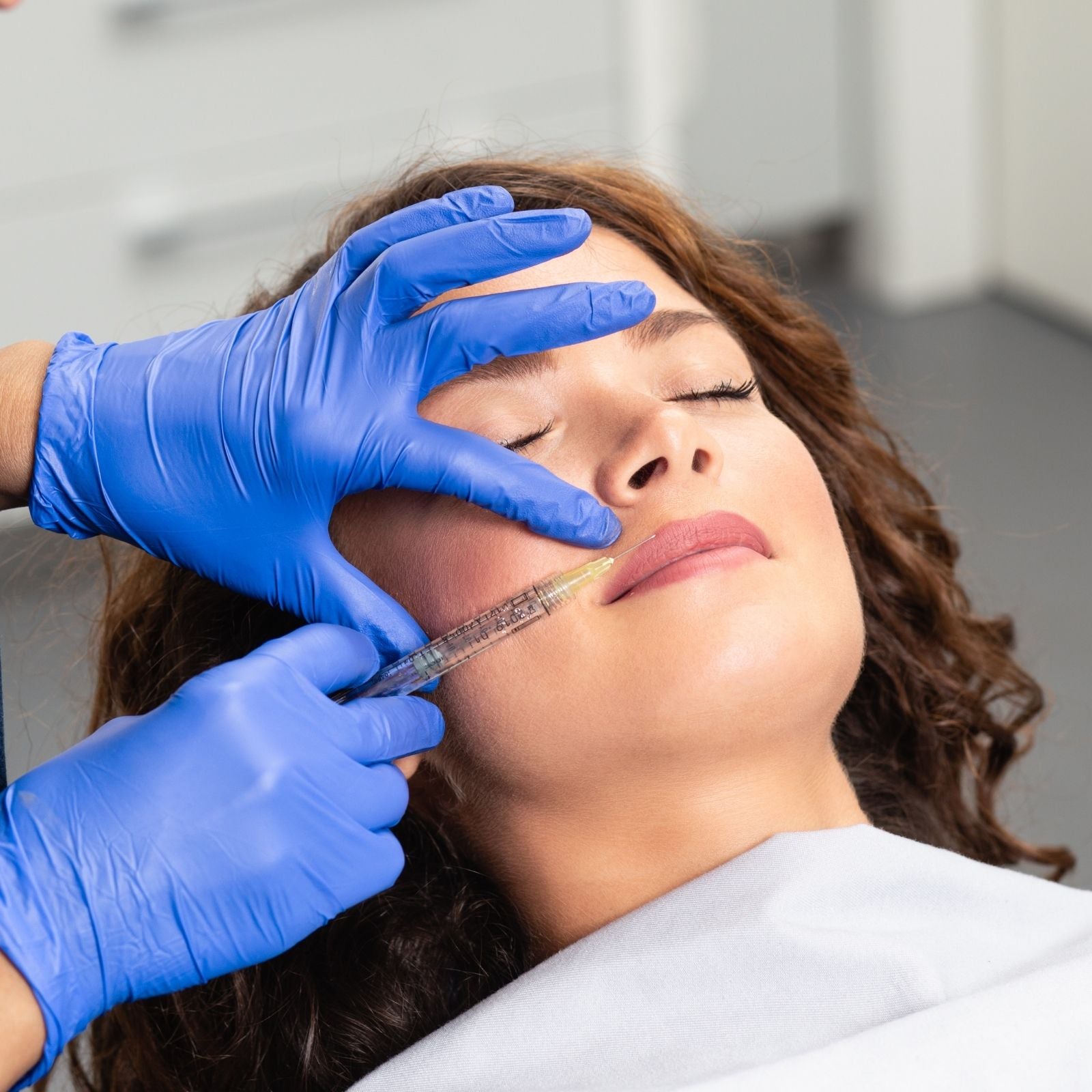 Professional lip filler treatment being performed at Injections & Co., a Sarasota Med Spa specializing in natural lip enhancement